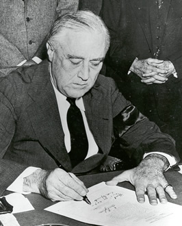 Photograph of FDR signing